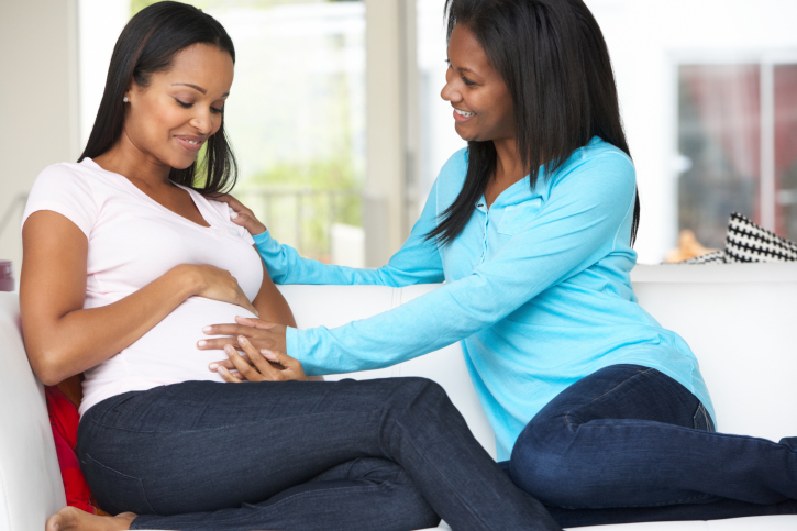 woman visiting pregnant friend