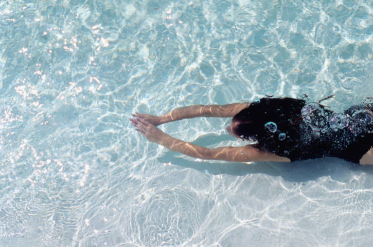 African American woman swimming