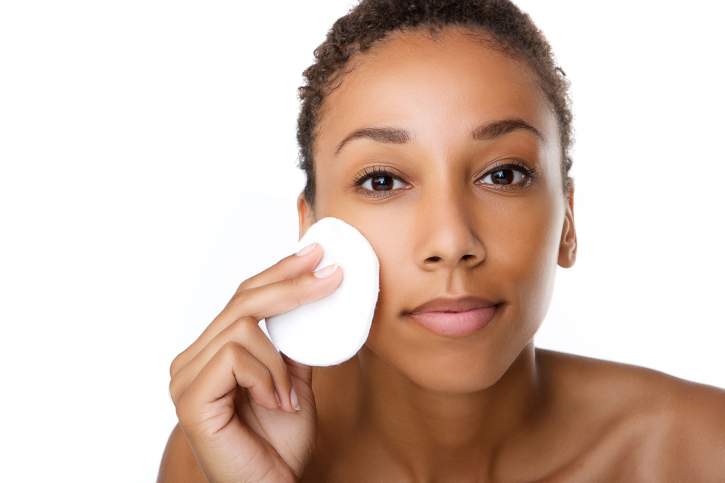 woman removing makeup 