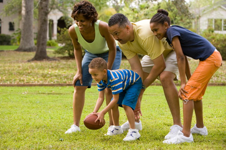 Family playing football