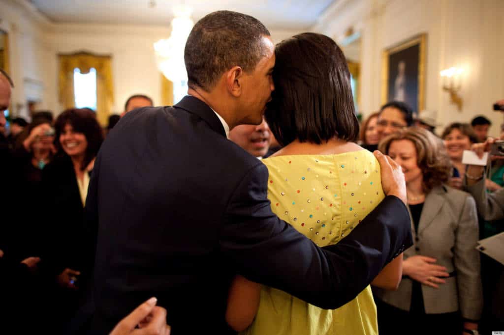 WASHINGTON - MAY 4: In this handout provide by the White House, U.S. President Barack Obama whispers into First Lady Michelle Obama's ear during the White House Cinco de Mayo celebration on May 4, 2009 in Washington, DC. Obama is serving as the 44th President of the U.S. and the first African-American to be elected to the office of President in the history of the United States. (Photo by Pete Souza/White House via Getty Images)