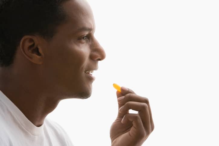 man taking pill