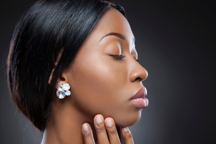 African American woman close up profile large earrings
