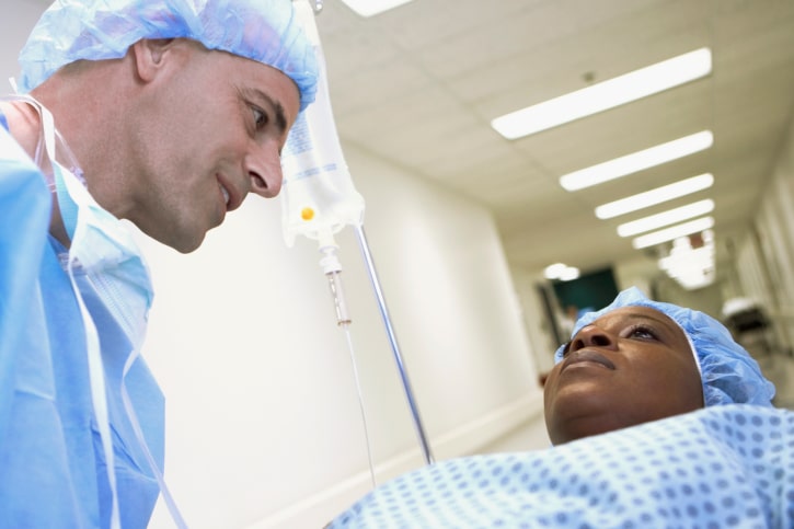 surgeion talking to African American woman in hospital