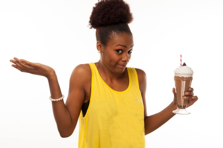 African American Black woman deciding if she wants milkshake