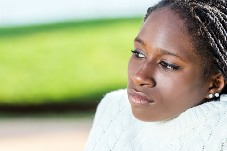 African American girl sitting outside