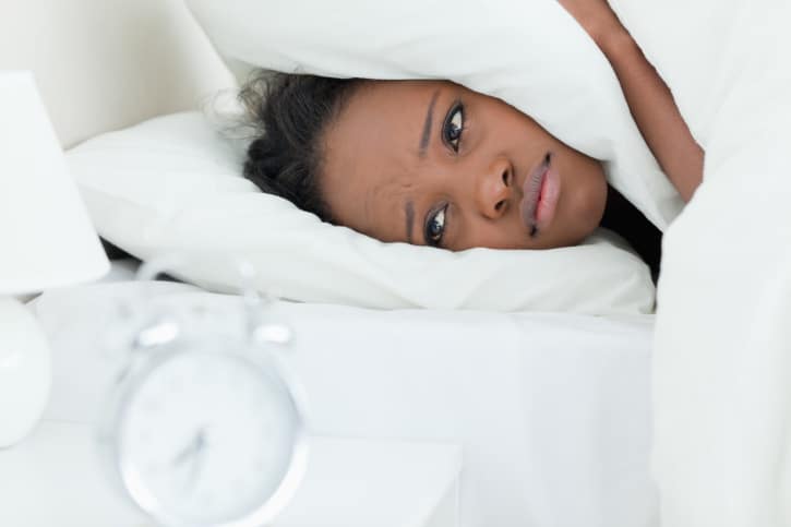 African American woman in bed
