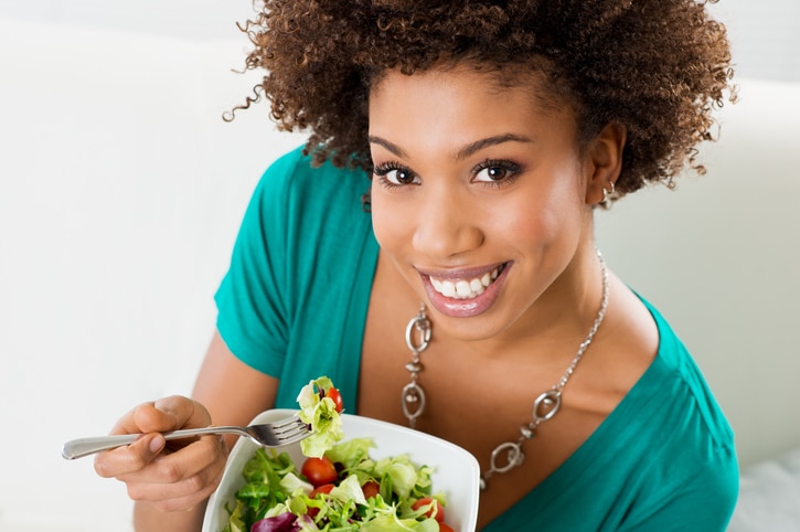 woman eating salad