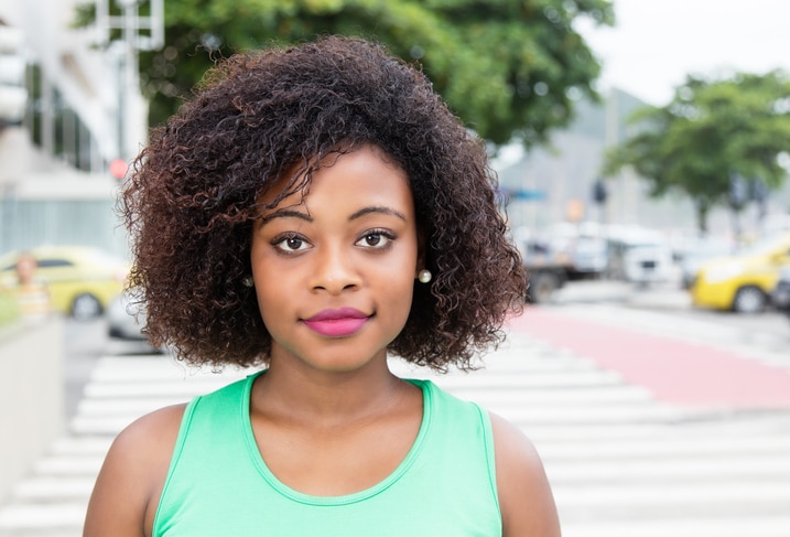 African American woman smiling with natural hair