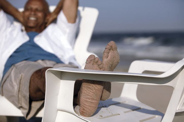 African American man relaxing on beach