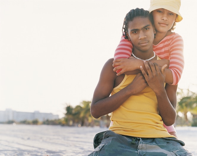 African American Teenage couple on beach