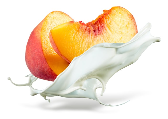 Peach is falling into milk