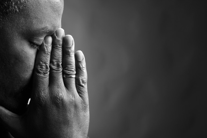 African American man upset sad grieving