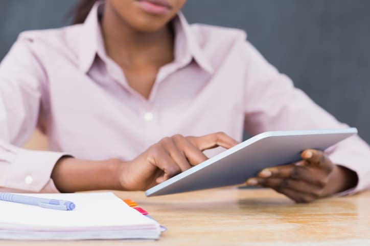 African American woman teacher using a tablet