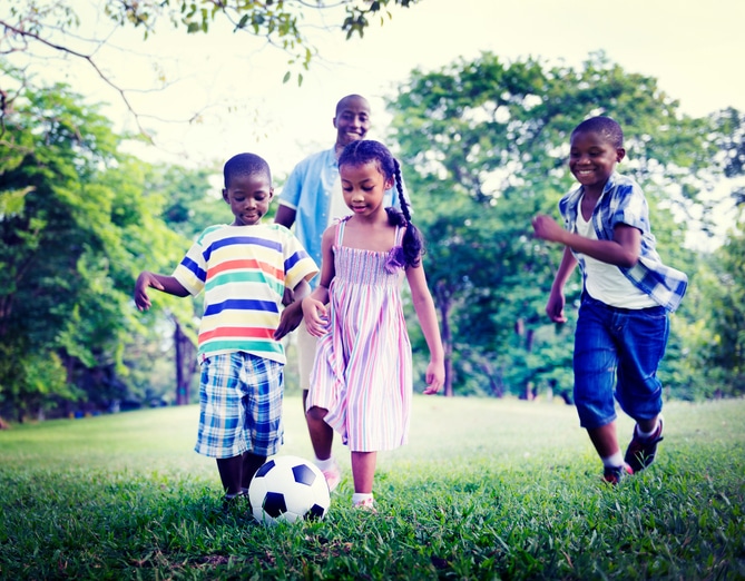 African American family playing outside