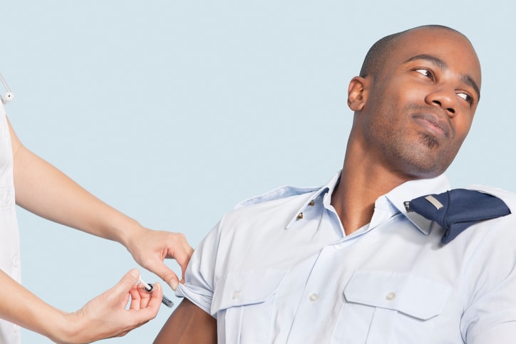 man getting shot in arm