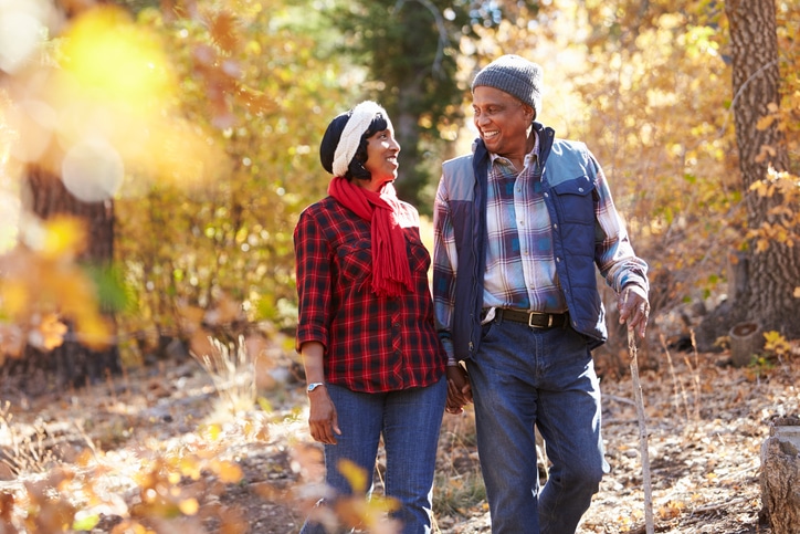 African American couple walking autumn