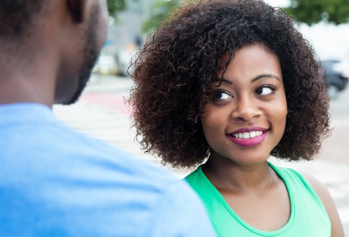 African American woman smiling flirting