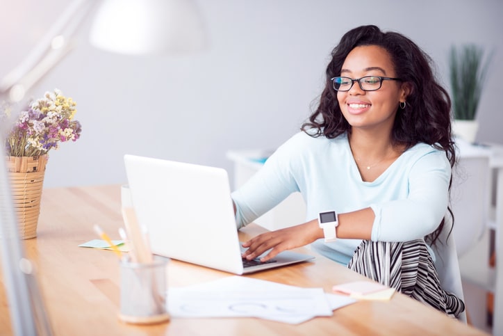Young african american woman on laptop