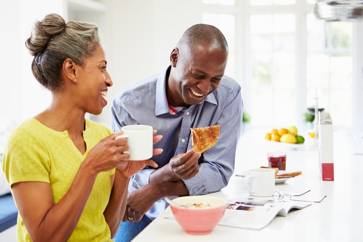African American couple eating breakfast
