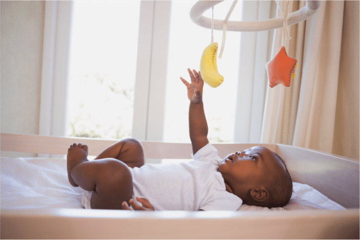 African American baby in crib
