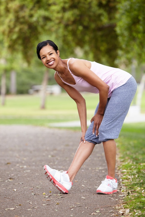 African American woman exercising outside