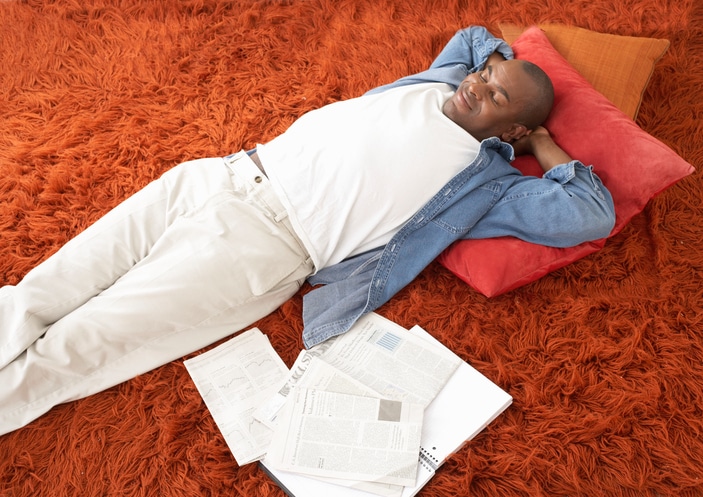 African American man laying down sleeping