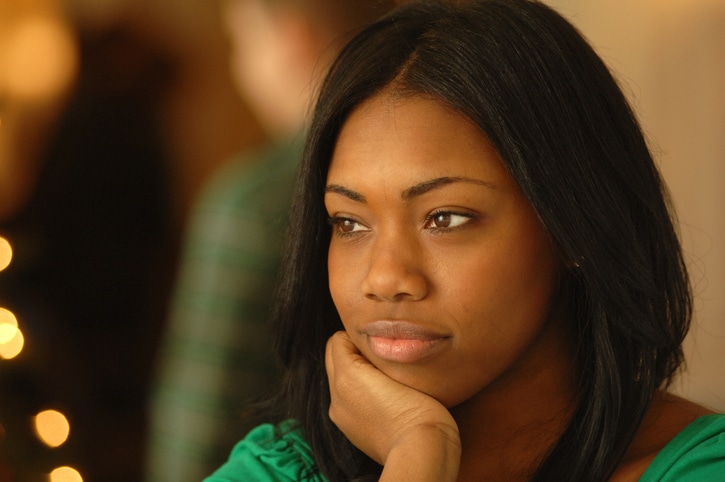 Black girl lost in thought.