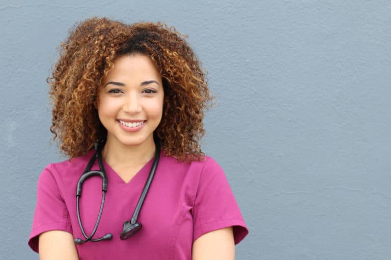 Black woman nurse with stethoscope.