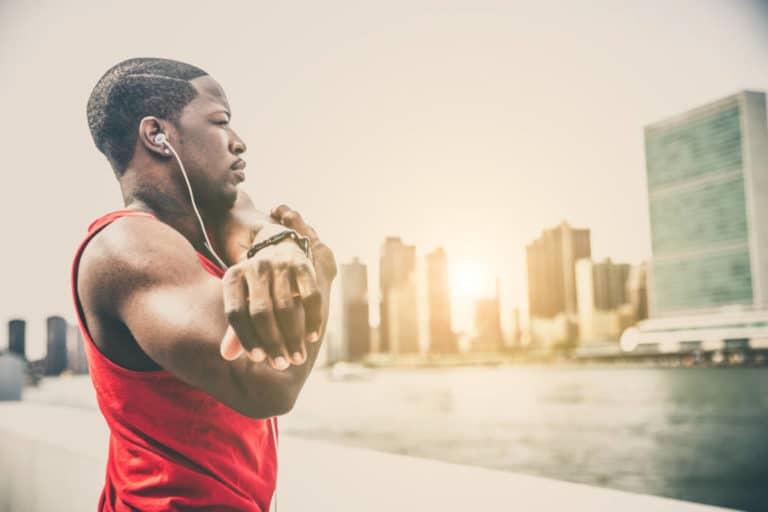 Runner stretching and training outdoors.