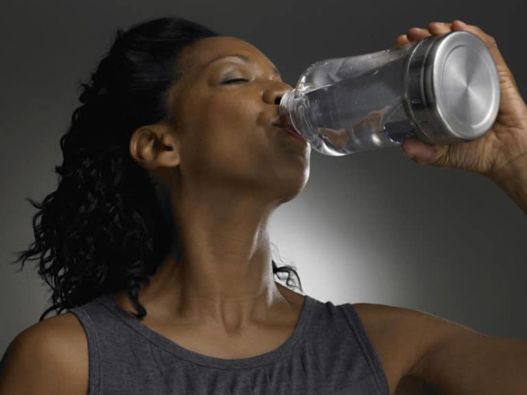 Woman drinking water.