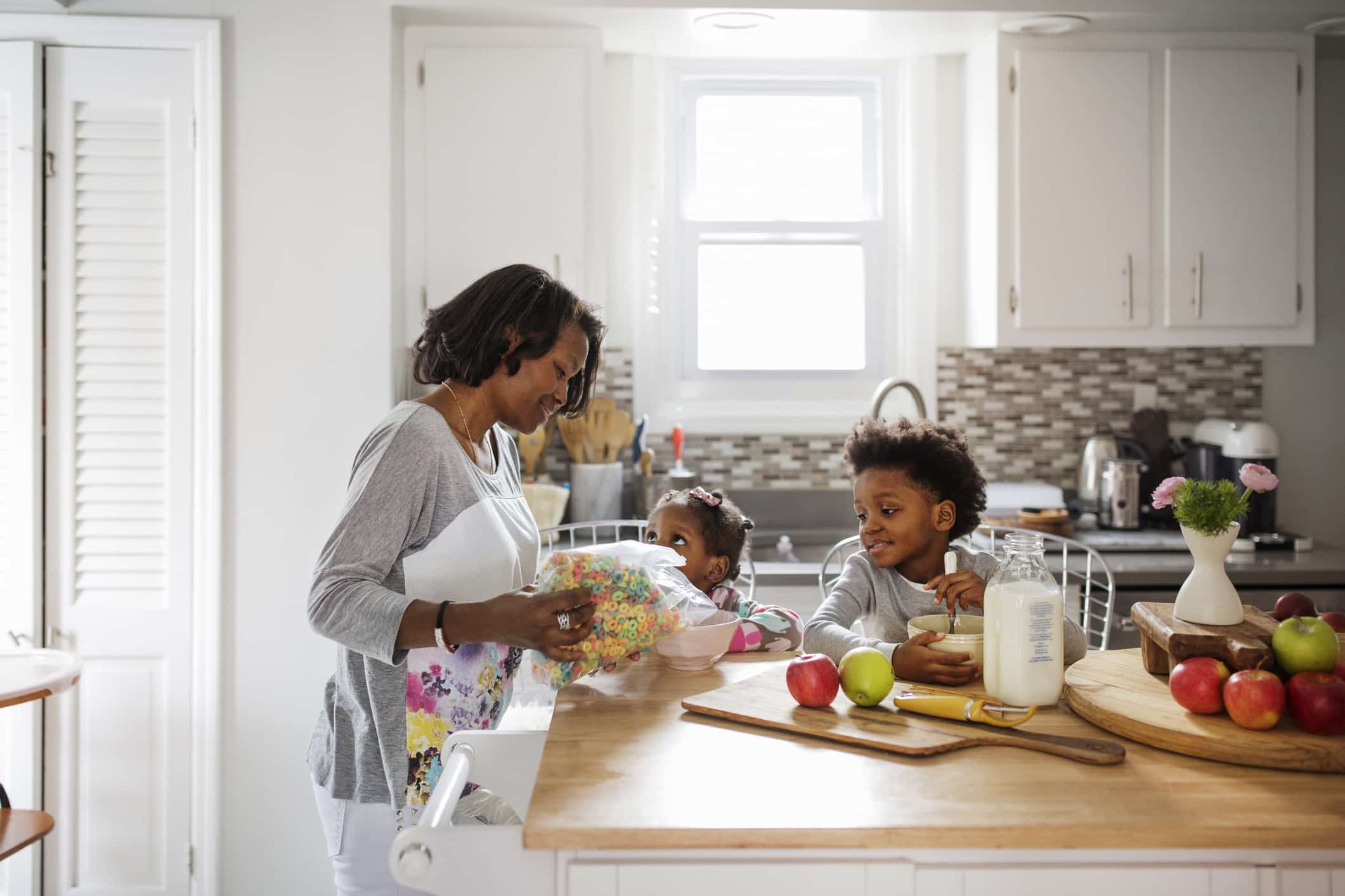 Mother serving breakfast