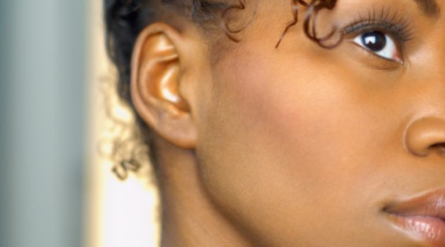 close up of side profile of african american woman ear migraines
